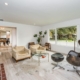 1. Cozy living room with a fireplace and chairs, perfect for relaxation and gatherings.