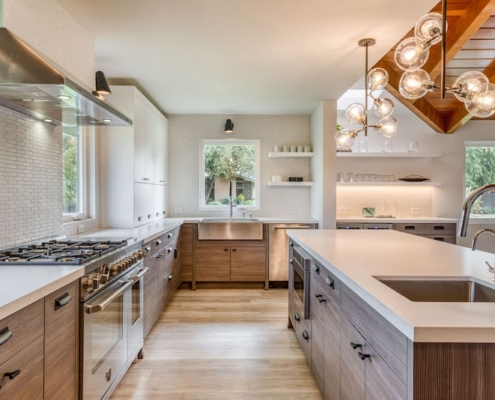 Modern kitchen with spacious island and stainless steel appliances, perfect for cooking and entertaining