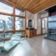 A spacious bathroom featuring a sizable glass shower and a generously sized window.