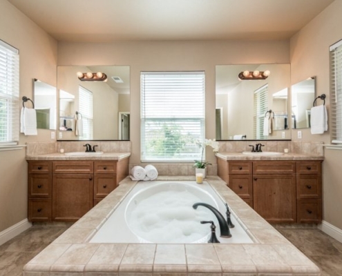 Photo of interior view of luxurious bathroom showing bubble-filled bathtub