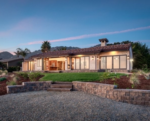 Photo of scenic view-front of luxurious house with mountain range background